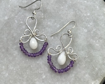 The Emma earring: hand formed sterling silver wire with a white jade  teardrop bead and a string of purple amethyst round beads