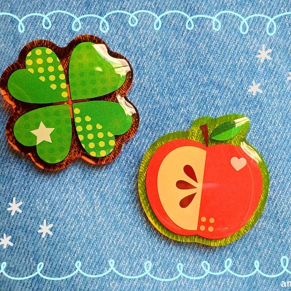 Przypinki Apple i Clover