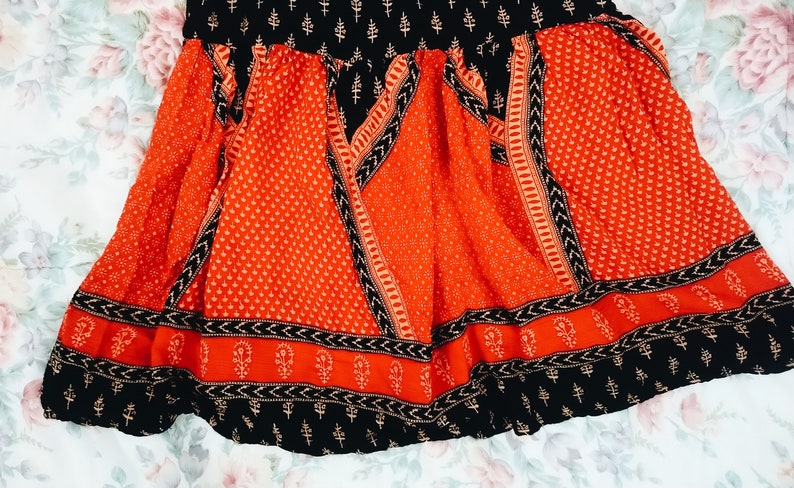 Upcycled sleeveless bohemian red and black tunic blouse