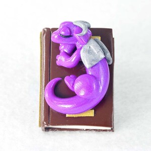 Random miniature dragon guarding a book - mystery listing - tiny clay dragon - geeky fantasy book lover gift - baby bookwyrm figurine