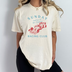 sunday racing club meet me at the paddock f1 tee light blue + red | ivory comfort colors shirt | formula 1 racing inspired aesthetic  tshirt