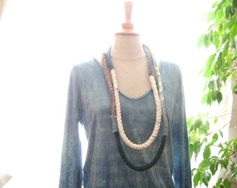 Hand stitched and naturally dyed textile necklace made of antique French linen hemp, indigo plant dyed patchwork rope wrap