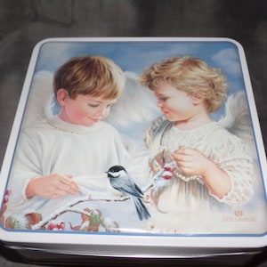 Vintage 4 sided Tin Two Angles Taking Care of a Bird