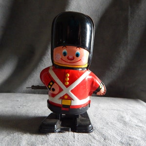 Vintage Yone Tin British Soldier Walking Guardsman