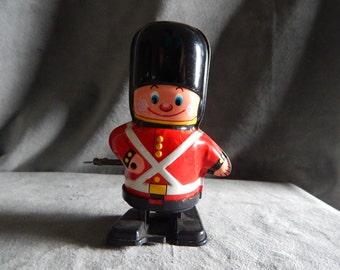 Vintage Yone Tin British Soldier Walking Guardsman
