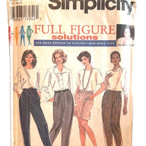 May include: Simplicity sewing pattern 9712 for full figure solutions. The pattern includes illustrations of women wearing various outfits. The size is GG, 26W-32W. The text on the pattern reads "FULL FIGURE solutions".