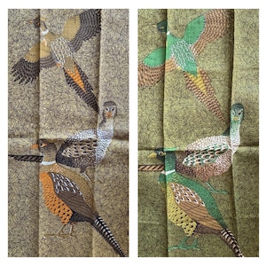 May include: Two panels of fabric with pheasant illustrations. The birds are depicted in shades of brown, orange, green, and white, with detailed feather patterns. The background is a muted green with a leaf pattern.