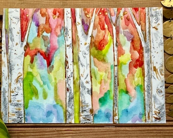 May include: Watercolor painting of a forest scene with birch trees and colorful foliage. The trees are painted in shades of white and gray, while the foliage is a mix of red, orange, yellow, green, and blue.