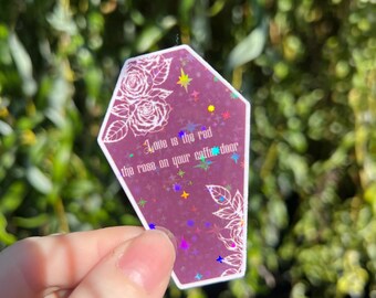 O amor holográfico é o vermelho da rosa no adesivo da porta do seu caixão