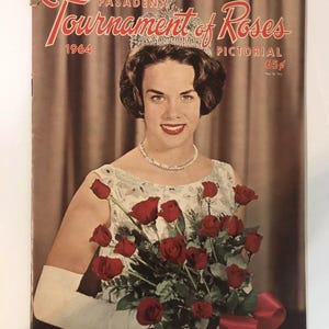 May include: A vintage 1964 Pasadena Tournament of Roses Pictorial magazine cover featuring a woman wearing a crown and holding a bouquet of red roses. The cover is in good condition with some wear and tear.
