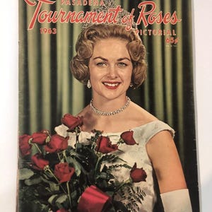 May include: A vintage 1963 Pasadena Tournament of Roses Pictorial magazine cover featuring a woman in a white dress holding a bouquet of red roses. The cover text reads "Pasadena Tournament of Roses Pictorial 65¢".