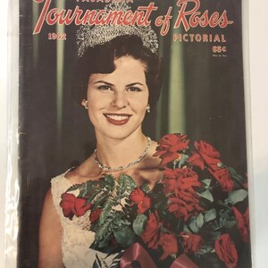 May include: A vintage 1962 Pasadena Tournament of Roses Pictorial magazine cover featuring a woman wearing a crown and holding a bouquet of red roses. The cover text reads "Pasadena Tournament of Roses Pictorial 65c".