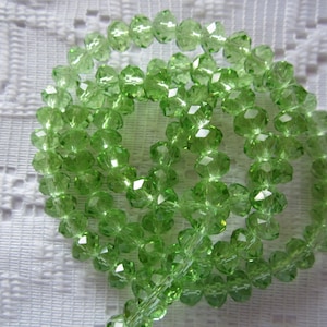 25 Perle sfaccettate in Cristallo Rondelle Verde Mela 6mm x 4mm