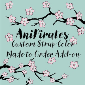 May include: An illustration on a teal background features black branches with pink cherry blossoms. The text reads "AniPirates Custom Strap Color Made to Order Add-on."