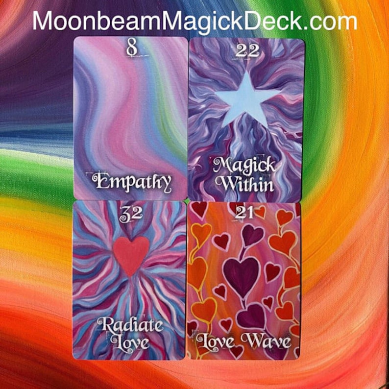 May include: Four colorful oracle cards with the words "Empathy", "Magick Within", "Radiate Love", and "Love Wave". Each card features a unique design with hearts, stars, and abstract patterns in shades of pink, purple, and orange. The website MoonbeamMagickDeck.com is at the top.