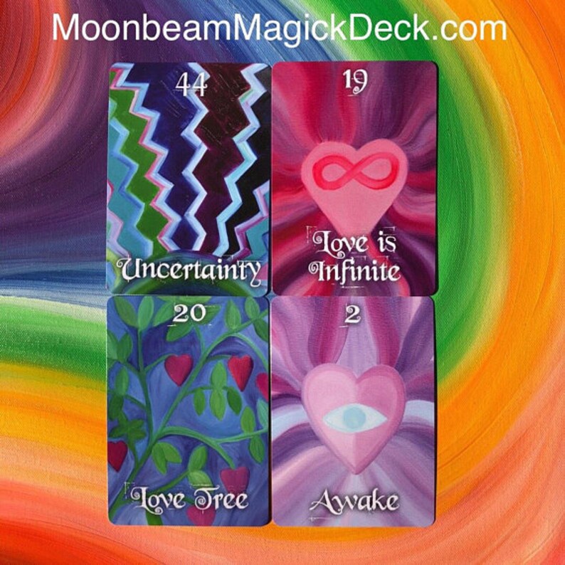 May include: Four tarot cards with colorful illustrations and text. The cards feature images of hearts, trees, and abstract patterns. The text includes words like "Uncertainty," "Love is Infinite," "Love Tree," and "Awake."