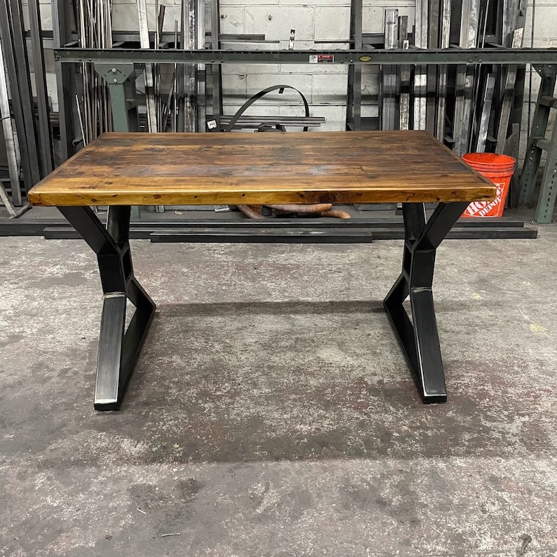 Metal table legs x style with square opening to hold beam.  Industrial modern table legs made in the usa