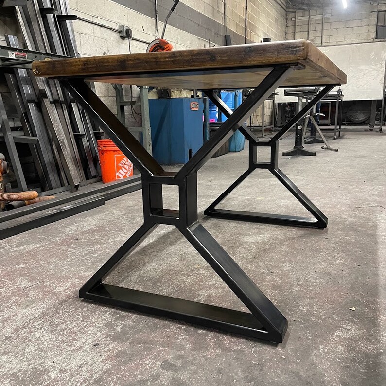 Metal table legs x style with square opening to hold beam.  Industrial modern table legs made in the usa