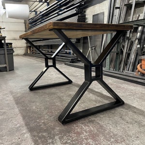 Metal table legs x style with square opening to hold beam.  Industrial modern table legs made in the usa