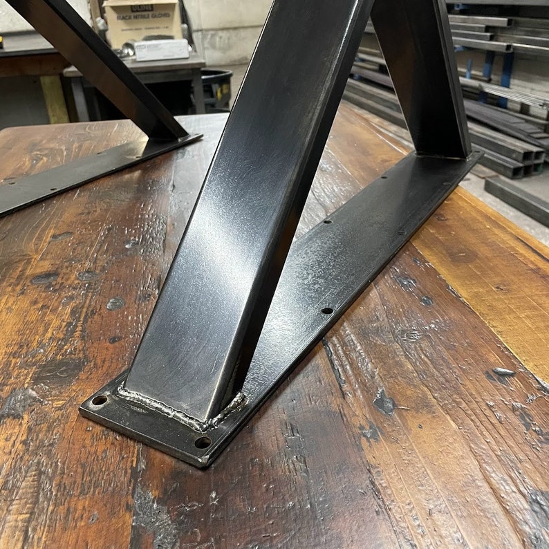 Metal table legs x style with square opening to hold beam.  Industrial modern table legs made in the usa