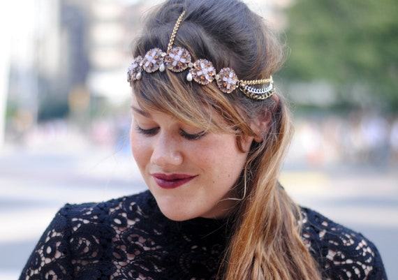 a jeweled headpiece similar to a crown is