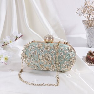 Pale blue top satin clutch bag