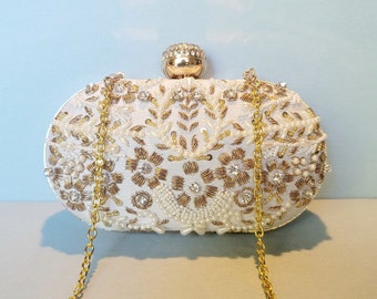 white and gold clutch purse