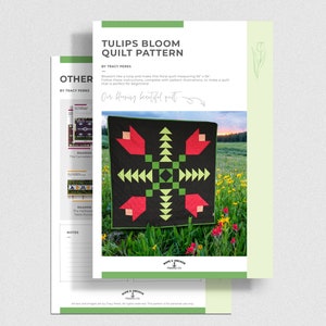 May include: A quilt pattern for a floral quilt with tulips, called "Tulips Bloom Quilt Pattern" by Tracy Perks. The quilt is black with red tulips and green and yellow geometric shapes. The quilt is displayed on a grassy field with wildflowers.