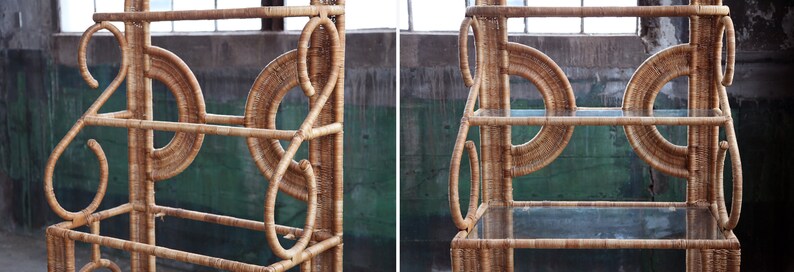 May include: A natural woven rattan shelf unit with three glass shelves. The shelf has a unique design with circular and curved elements.