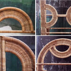 May include: A natural woven rattan shelf unit with a unique arched design. The shelf has three levels and is made of natural brown rattan.