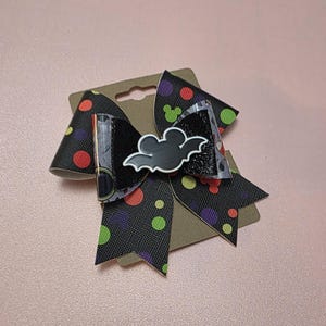 May include: A set of three ceramic mugs with a speckled, matte finish. The mugs are in shades of cream, light gray, and dark gray. Each mug has a simple, minimalist design, perfect for coffee or tea.