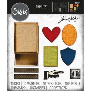 May include: Sizzix Thinlits 666604 die set featuring a matchbox shape, a red heart, an orange oval, a yellow rectangle, a blue shield, two dark brown strips, a black and white pointing hand icon, and a letter T square with 10 dies total.