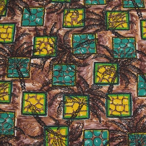 May include: A brown fabric with a repeating pattern of green, yellow, and brown squares. The squares contain a variety of designs, including a pattern of small circles, a stylized tree, and a pattern of small squares.