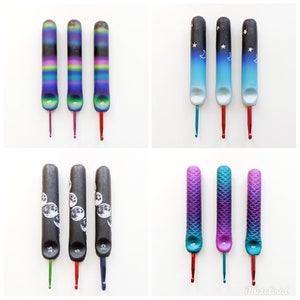 May include: Set of nine colorful crochet hooks with different designs. The hooks are made of plastic and have a smooth finish. The designs include a galaxy, stars, moons, and mermaids. The hooks are numbered 3.5, 5, 6, 8, 9, and 10.