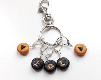 Set of 5 Black and Gold 'LOL' Stitch Markers. Universal for knitting and crochet.  Gold. Black. Ready to ship