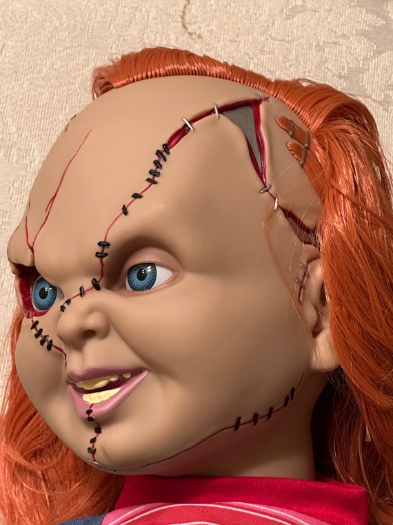 Haunted chucky doll sale