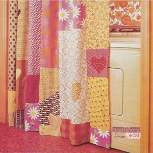 May include: A patchwork shower curtain with a pink, orange, and yellow color scheme. The curtain features a variety of floral and geometric patterns, including hearts and daisies. The curtain is hanging in a bathroom and is partially covering a white washing machine.