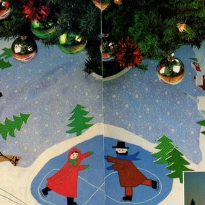 May include: A white Christmas tree skirt with a winter scene. The skirt features a blue ice skating pond with two figures skating, a red sled being pulled by a brown horse, and green trees. The text "R SCENICS" is printed on the bottom of the skirt.