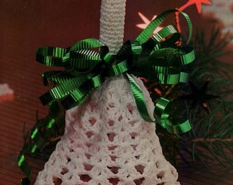May include: White crocheted bell with a green ribbon bow. The bell is a Christmas ornament.