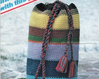 May include: A striped crocheted drawstring bag with a black, brown, yellow, green, purple, blue, and orange color scheme. The bag has a long, braided cord with tassels.