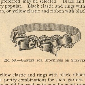 May include: A black and white illustration of a garter for stockings or sleeves. The garter has a bow and is decorated with a lace trim. The text "No. 58. GARTER FOR STOCKINGS OR SLEEVES." is printed below the image.