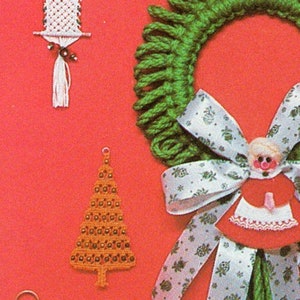 May include: A set of four handmade Christmas ornaments. The ornaments are made of yarn and beads. The ornaments include a green wreath with a white ribbon, a brown Christmas tree, a white owl, and a red and white doll.