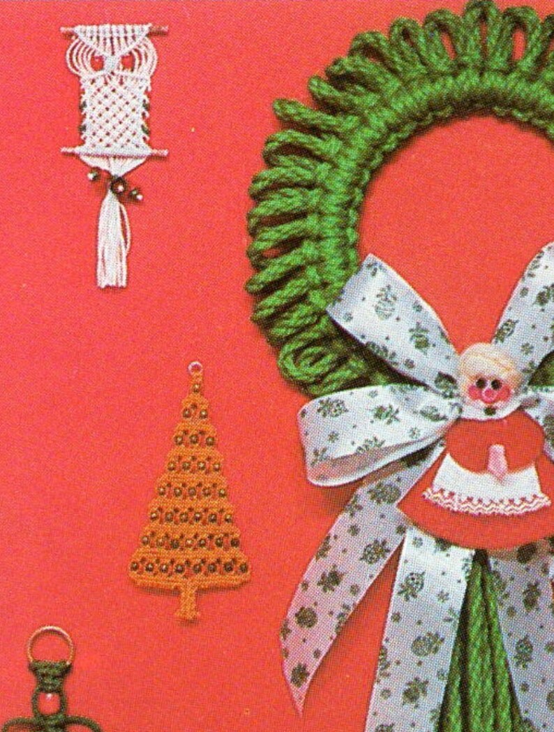 May include: A set of four handmade Christmas ornaments. The ornaments are made of yarn and beads. The ornaments include a green wreath with a white ribbon, a brown Christmas tree, a white owl, and a red and white doll.