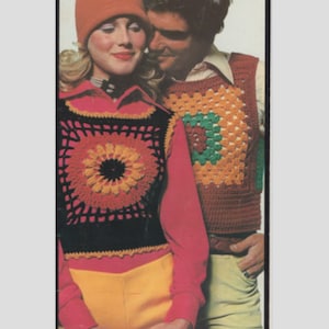 May include: A couple wearing crocheted vests with colorful geometric patterns. The woman is wearing a red hat and yellow pants. The man is wearing brown pants.