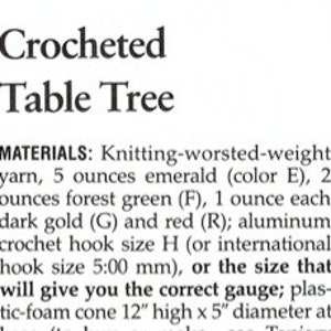 May include: A text document titled Crocheted Table Tree listing materials including 5 ounces of emerald yarn, 2 ounces of forest green yarn, 1 ounce each of dark gold and red yarn, a size H crochet hook, and a 12 inch high by 5 inch diameter cone.