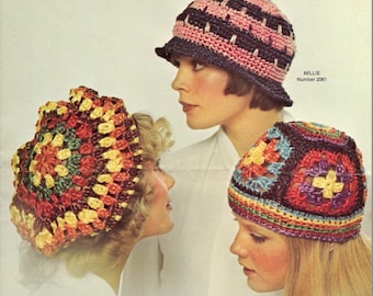 May include: Three women wearing crocheted hats. The hats are in different colors and patterns. The woman on the left is wearing a multi-colored hat with a square pattern. The woman in the middle is wearing a black and pink striped hat. The woman on the right is wearing a multi-colored hat with a square pattern.