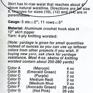 May include: Instructions for crocheting a fringed skirt with yarn in various colours, including maroon, emerald green, purple, medium red, medium blue, avocado green, hot pink, bright red, orange, gold, white, lime green, and mauve. The yarn amounts are listed in ounces and yards.
