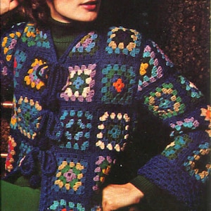 May include: A blue crocheted jacket with colorful granny squares. The jacket has a tie closure and long sleeves.