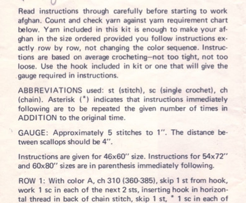 May include: A close-up of a printed page with crochet instructions. The text includes abbreviations, gauge information, and instructions for different sizes, including 46x60 inches, 54x72 inches, and 60x80 inches. The instructions are for making an afghan.