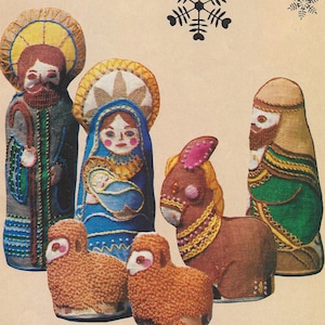 May include: A nativity scene with a brown donkey, two brown lambs, and three figures. The figures are a man with a blue robe and a staff, a woman with a blue robe holding a baby, and a man with a green robe. The figures are embroidered with colorful details.